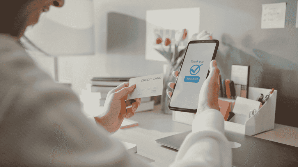 UK business owner receiving next day settlement notification on a digital device, symbolizing faster payouts and improved cash flow